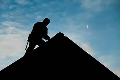 Maintenance plumber on roof