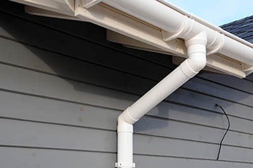 white gutters and downpipe installation