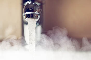 steaming hot water from a tap